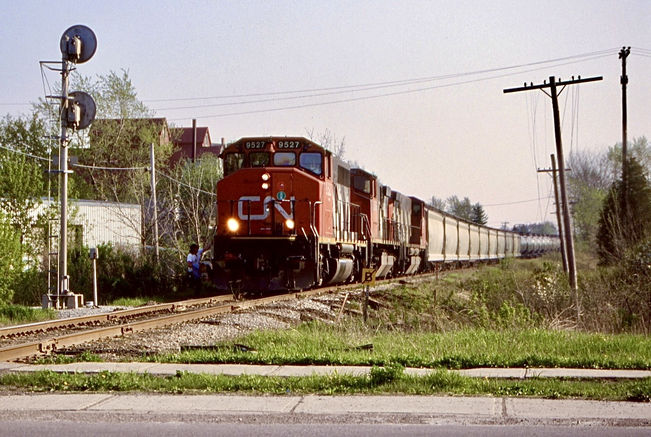 How has it been 25 years already. I always found Hagersville such an interesting railroad town. I so wish the old Canada Southern survived.  Back then any chance to railfan Railink was a good day out with an interesting roster. In the beginning motive power shortages forced them to lease CN M420’s and later GP40’s, GP38’s and GP9’s. I miss these days but glad I spent the time I did. Even though back then the old CASO was unused, Railink always had to stop and manually get the signal to cross the diamond in Hagersville. Today everything here has been removed other then the Hagersville subdivision itself and the majority of the CASO has been erased from the landscape never to return again.  Borrowed CN GP40 9527 leads the Brantford bound train across the now removed diamond. The covered hoppers are out of the now closed power plant in Nanticoke.