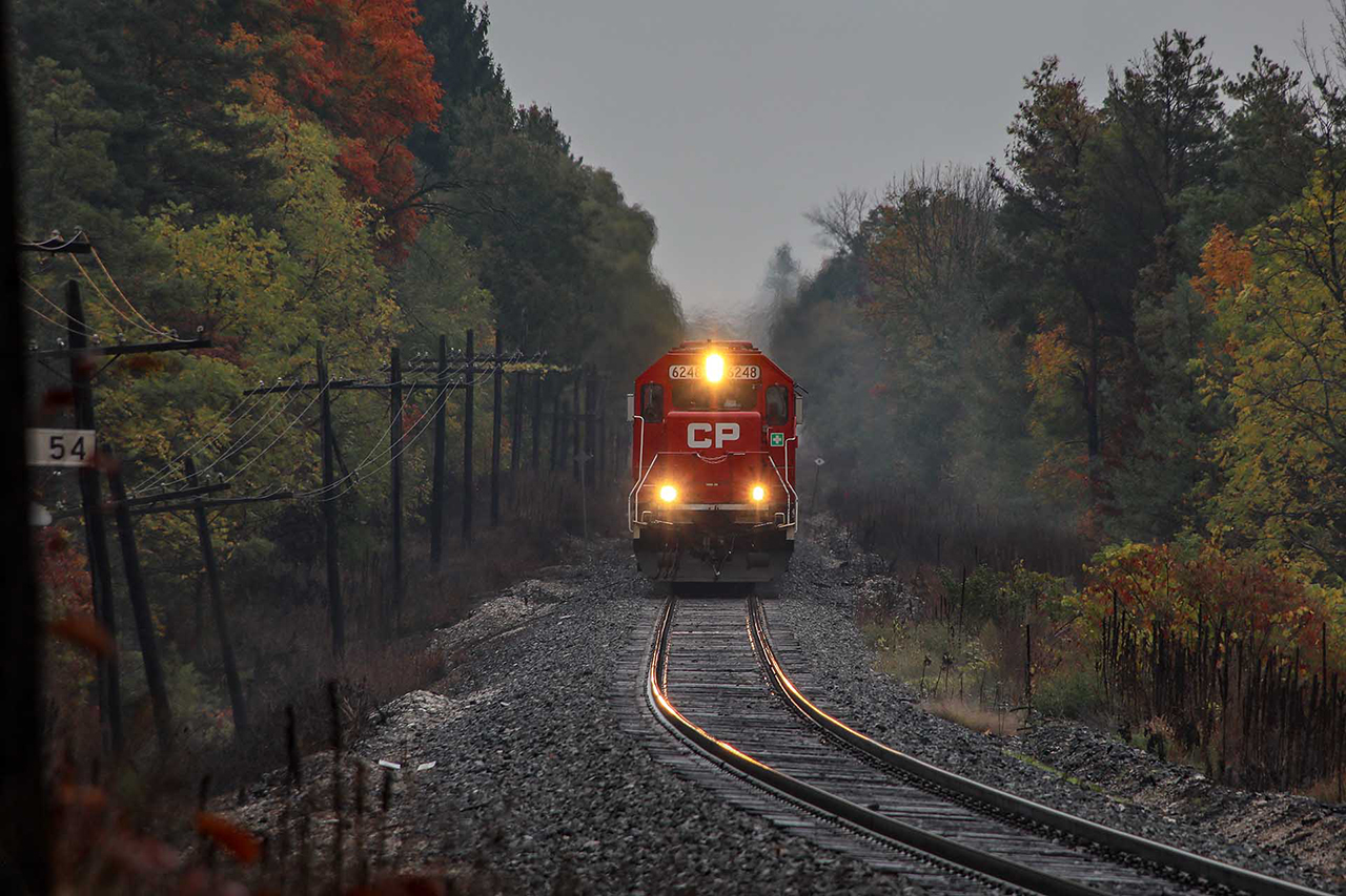 There are some days you just have no interest in going out. But the "triplets" (2 SD60s and an SD30ECO that were on 254-255 London to Buffalo for about 7 weeks) are coming. I still believe that was the last time I see a lashup like that. So it's raining, foggy, kind of miserable, but there's a little fall colour starting too. I'm so glad I went.