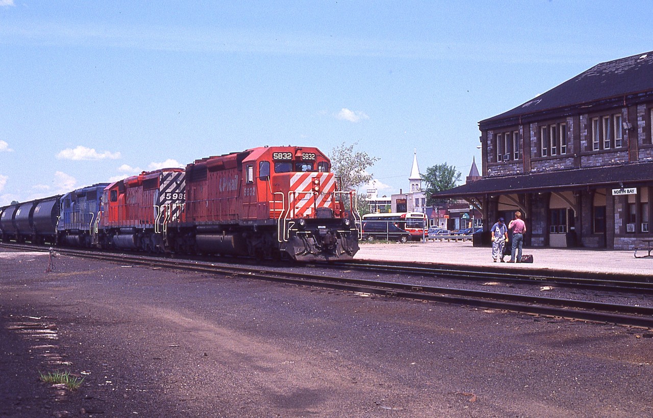 Eastbound CP #486, behind CP 5832, 5989 and EMDX 6417; slows for a crew change at the CP North Bay station. This scene is an event of the past.
 In 1999 the line was negotiated to be under control of the Ottawa Valley Railway, operated by Rail Link, which is the CDN subsidiary of RailAmerica.
 In 2009, CP decided rather than to continue using this line which went down the Ottawa Valley to Smiths Falls, that they would reroute their trains over their own line, running south from Sudbury.
 As a result, the OVR line became unprofitable and despite many attempts to save it; it was abandoned east of Mattawa and the pulling up of the track began in 2012.
 The controversy over the lifting of the North Bay sub east of Mattawa and all the Chalk River Sub. was intense, but if traffic didn't warrant keeping the line in the ground; what was the point?