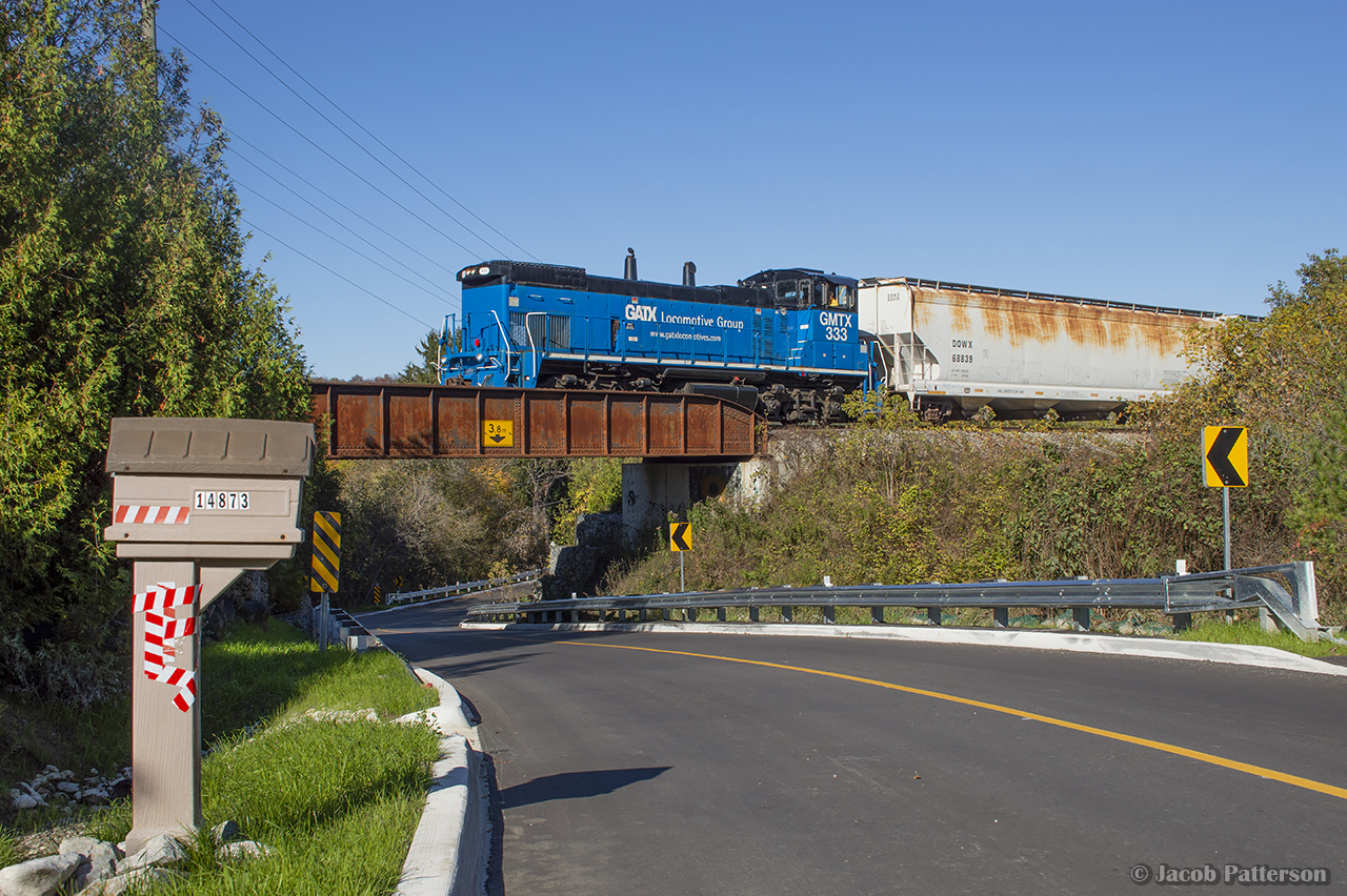 Just over two months remain for the OBRY as leased GMTX 333 clunk over the small bridge at Boston Mills.  The twice-weekly train is working its way south towards the CP interchange at Streetsville where four cars are waiting for the trip to Orangeville.
