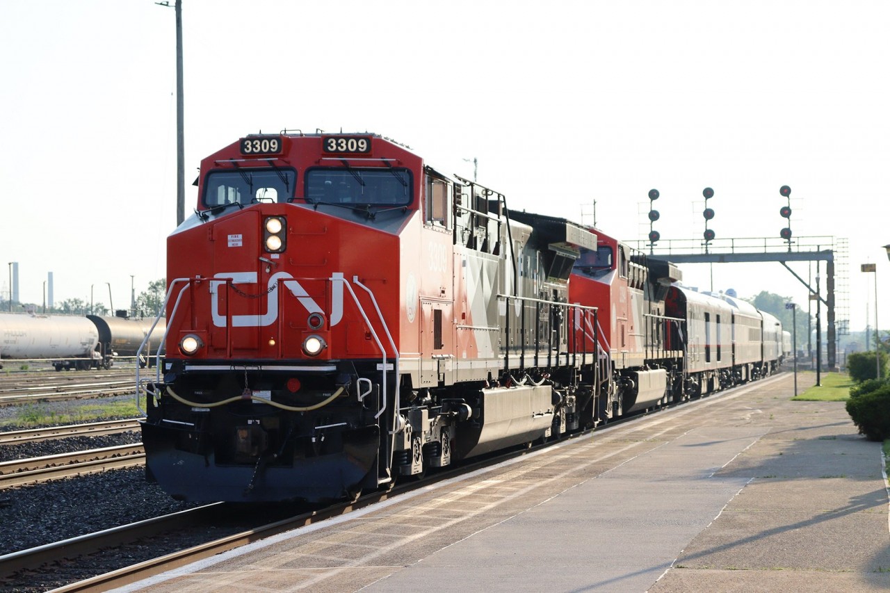CN 3309 and 3394 lead CN's Safety Train into Sarnia, Ontario, where they will stop at the Sarnia VIA station for Canada Customs check in before parking in the yard near the yard tower overnight.