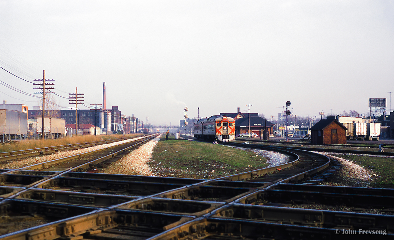 CP Rail 380, the Toronto - Peterborough Budds are seen passing through West Toronto station, taking the Galt Sub to the west side of the interlocking.  After CN 987, the Toronto - Guelph commuter run clears, the Budds will be eastbound for Leaside and their regular routing.  For about ten days in April 1973, this move was done on account of mudslides on the Belleville Sub Don branch near the Prince Edward Viaduct.  On one occasion, there was an issue with the interlocking, and the Budds were required to use the Galt - Mactier connecting track, swinging east onto the North Toronto Sub at Osler.


Scan and editing by Jacob Patterson.
