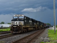 Train 716 rolls into Sarnia, ON., at Hobson under very threatening skies with triple Norfolk Southern power lead by NS 7692. The power was cut off on arrival and sent back to Port Huron, MI., light as K533, July 12, 2025.