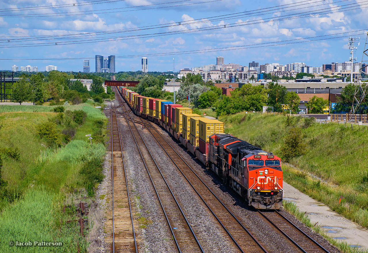 CN Z149 from Montreal crosses over to the bypass at Snider en route to Brampton Intermodal.  Overall not a ton of differences when compared to John Freyseng's 1986 view.