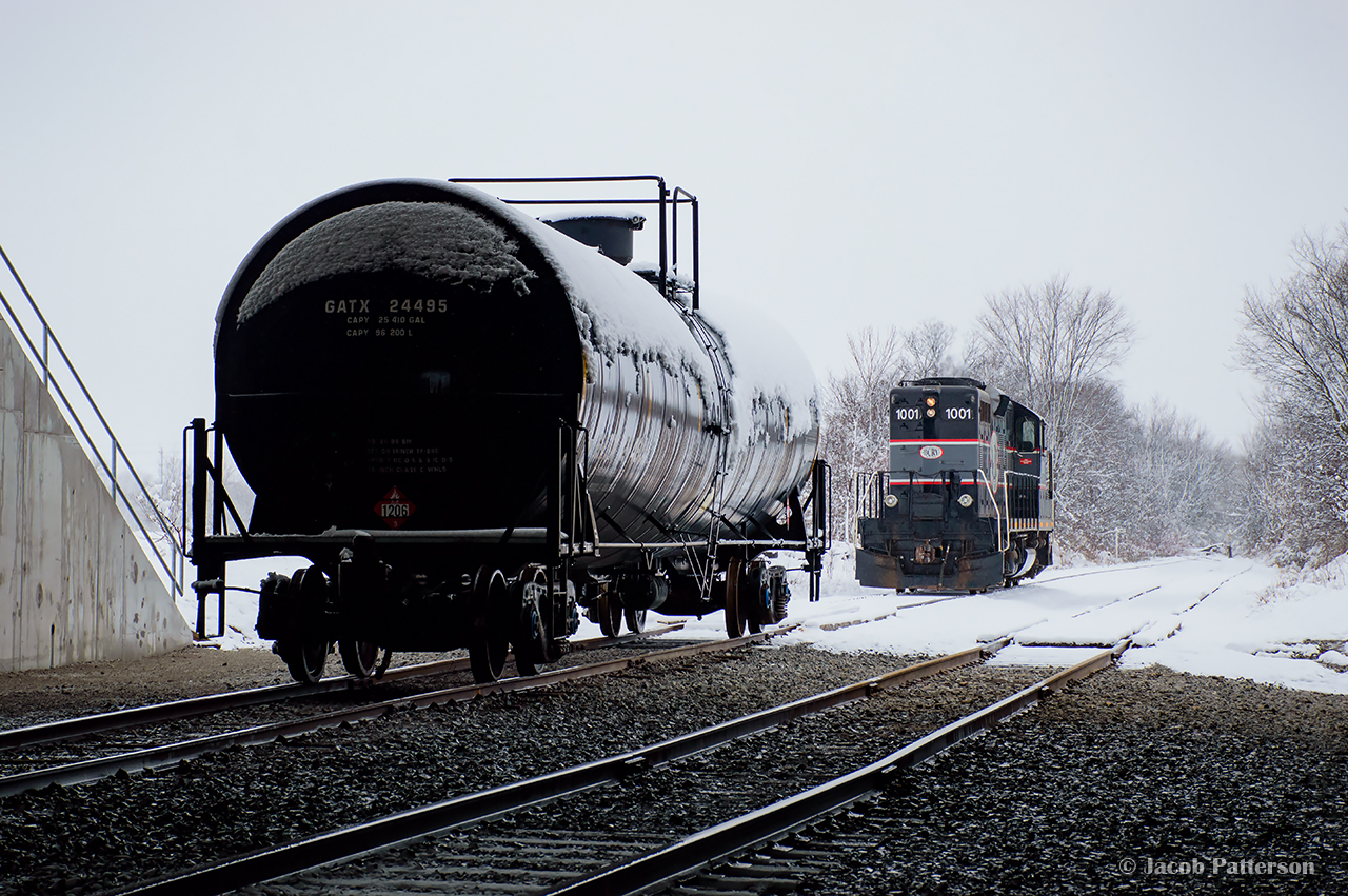 Barrie Collingwood Railway 1001 runs down the Beeton Sub main while running around the single car lifted from Comet Chemical.  ON their way back to Utopia, more traffic will be lifted from TAG Environmental.
