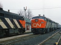 Engineers of the eastbound and westbound Super Continentals exchange waves as the Aurora station agent/operator with pipe in mouth, watches from the doorway.


<br><br><i>Scan and editing by Jacob Patterson.</i>

