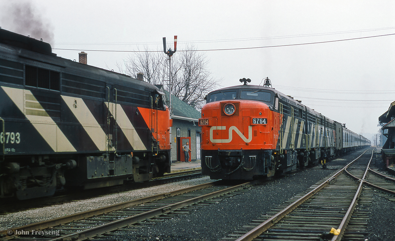 Engineers of the eastbound and westbound Super Continentals exchange waves as the Aurora station agent/operator with pipe in mouth, watches from the doorway.


Scan and editing by Jacob Patterson.