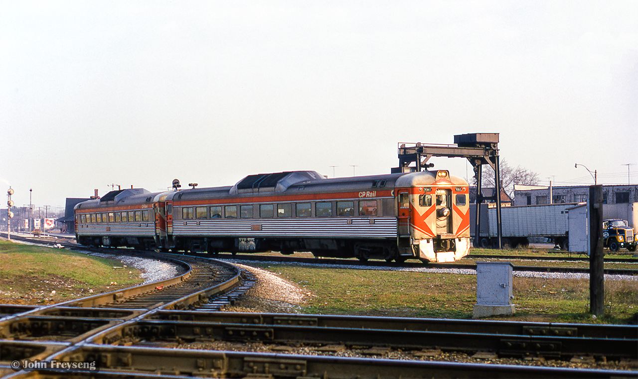 CP Rail 380, the Toronto - Peterborough Budds are seen passing through West Toronto, taking the Galt Sub to the west side of the interlocking. After CN 987, the Toronto - Guelph commuter run clears, the Budds will be eastbound for Leaside and their regular routing. For about ten days in April 1973, this move was done on account of mudslides on the Belleville Sub Don branch near the Prince Edward Viaduct. On one occasion, there was an issue with the interlocking, and the Budds were required to use the Galt - Mactier connecting track, swinging east onto the North Toronto Sub at Osler.

Scan and editing by Jacob Patterson.