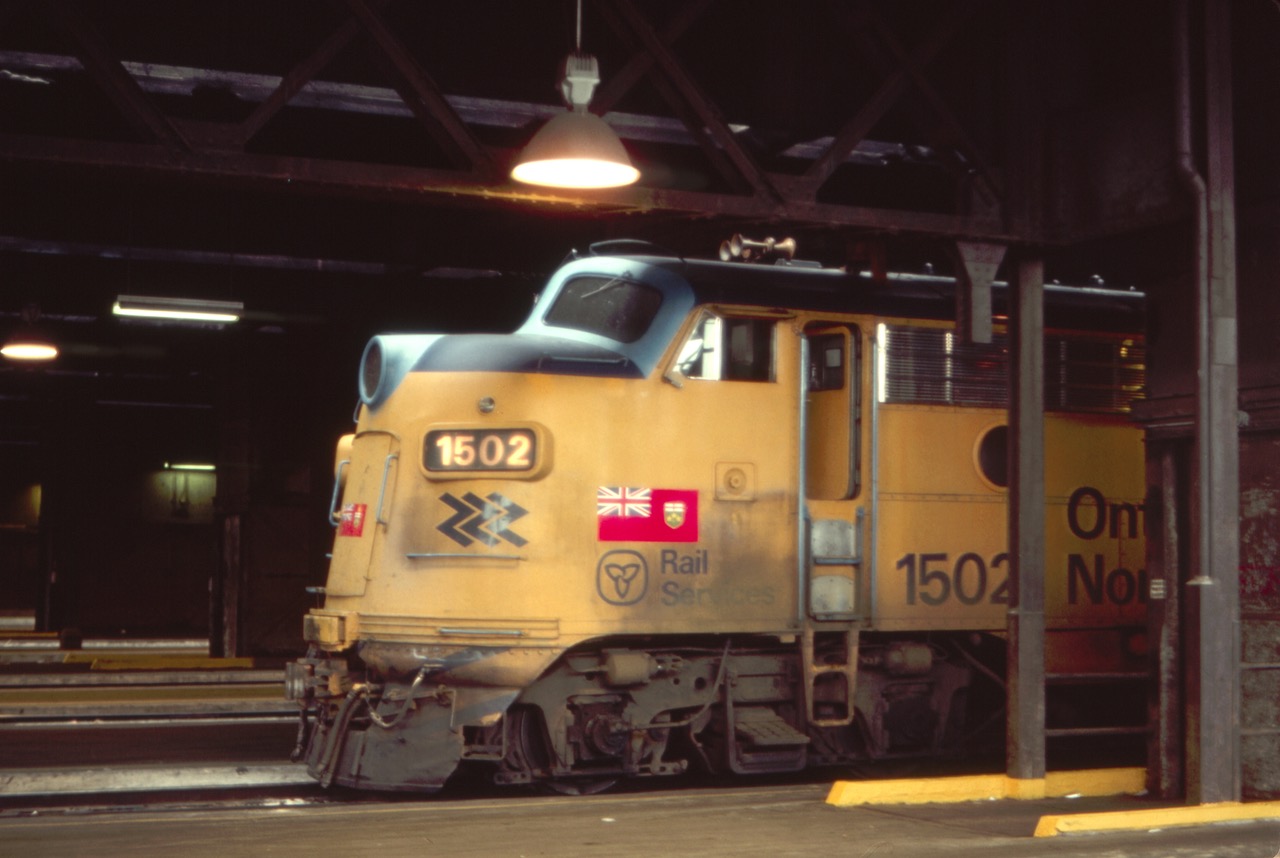 Ontario Northland F7 1502 is seen inside the trainshed of Toronto Union Station, ready to lead the "Northlander" passenger train out of town, on a hot August 1984 day.
