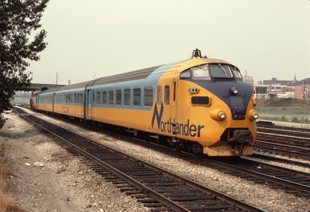 The Ontario Northland's "Northlander" is being brought down to the west end of Toronto Union Station by a switch crew in this August 1985 view. These trainsets with unusual cab cars and design were originally built in Europe in 1957 for use as part of the Trans Europe Express (TEE). Ontario Northland purchased them in 1977. Quite an unusual find indeed for a teenage railfan from Lyons, NY, on the Conrail mainline.