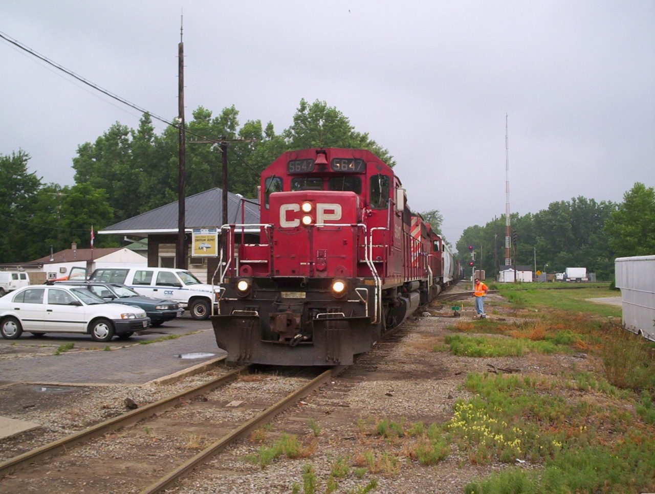 CSX train D725 arriving at the Chatham depot, the conductor or brakeman is on the ground to line the switch into CP's Chatham yard where they will back in the train. CSX Canadian crews (three man crew) ran this D725 from Sarnia to Chatham (and return north) with CP power (usually two SD40-2's) as CSX's main way to get traffic to the states was via CP agreement from Chatham to Detroit. This lasted only from 2003-2006.