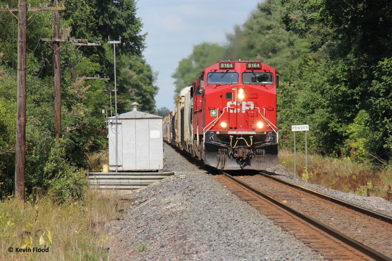 Just past Pender, CPKC 239 rockets westbound to London with CP 8164-CP 8178.