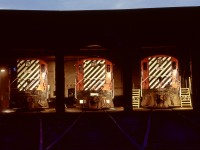 One of the advantages of working graveyard shift at Victoria’s CP roundhouse was ample time to try time exposure photography.  As it was a lone worker situation until around 0600 when folks started showing up for their daytime shifts, and lighting in the shop was mine to control (and maintain with 200 Watt globes and a long pole), views of units at rest were frequent.  On the next-to-last roll of film in a borrowed rangefinder camera before I purchased a Pentax Spotmatic, this view around 0500 PDT on Sunday 1972-05-14 with three Baldwin roadswitchers, CP 8005, 8002, and 8004 from left to right, in stalls 4, 3, and 2, shows what was normal when I started, but lasted only a few more years until the Baldwin roadswitchers were all shut down in March of 1975.