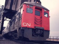 Back when I could still drive up to the tracks on the east side of the Welland canal, past the big GM plant, I would wander around a bit in hopes of seeing some rail traffic, which back then, was reasonably frequent.
Got caught out of position, so to speak, as the CN Railiners came roaring along, bound for Niagara Falls, and I had to shoot up the grade at them, right at the Welland Canal bridge.  Interesting angle, to say the least.
Budd RDC-3 #6355 was a baggage car as well has having seating for 48. It was rebuilt in 1981 as an RDC-2. I still think these were one of the most practical ideas for efficient passenger operations on the secondary lines.  Miss them.