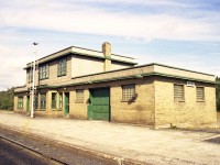 Here's an afternoon view of the old cinder block station, now closed,  just outside of Wawa.  Activity on the line here when the mines and smelter closed up in late 1997 and abandoned not long after. I'm not sure when the station was demolished but am guessing around early 1980s.The Michipicoten Sub is now in the history books, as is all the mining activity that once kept Wawa a vibrant community. The town has slipped from 4800 people down to about 2600, but fishing and hunting as well as a tourist stop along the Trans-Canada keep the town alive.
Even the rail station at Hawk junction where this branch met with the old AC mainline is now boarded up.  Along the Mic branch, Hawk Jct was mile 0, end of line at Michipicoten Harbor was mile 26, and the old station at 18.6.