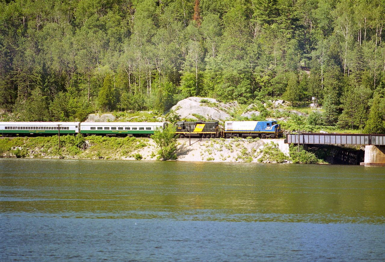 OVR 3582, 1703 with the Timber Train about to cross from Quebec over the Ottawa River on its return from Temiscaming to North Bay.  This operation was very short lived, only a couple of years in season, and perhaps the lack of a population base had a lot to do with poor ridership.
