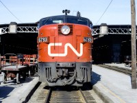 I am standing on a crosswalk at Toronto Union Station where CN 6793 is sitting in the sun in June 1970.