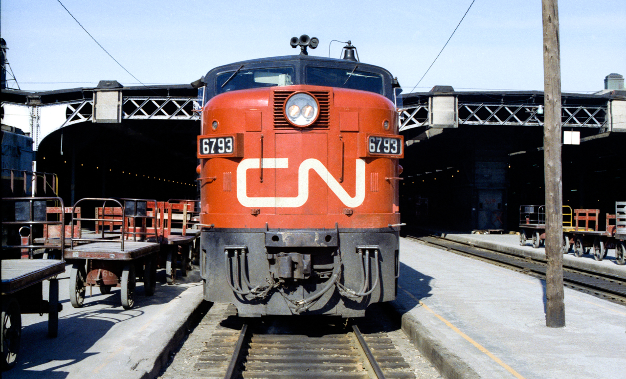 I am standing on a crosswalk at Toronto Union Station where CN 6793 is sitting in the sun in June 1970.