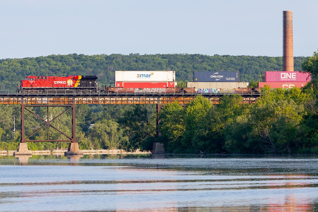 A regular scene as CPKC 113 crosses the Trent River pulled by a freshly painted CPKC leader.