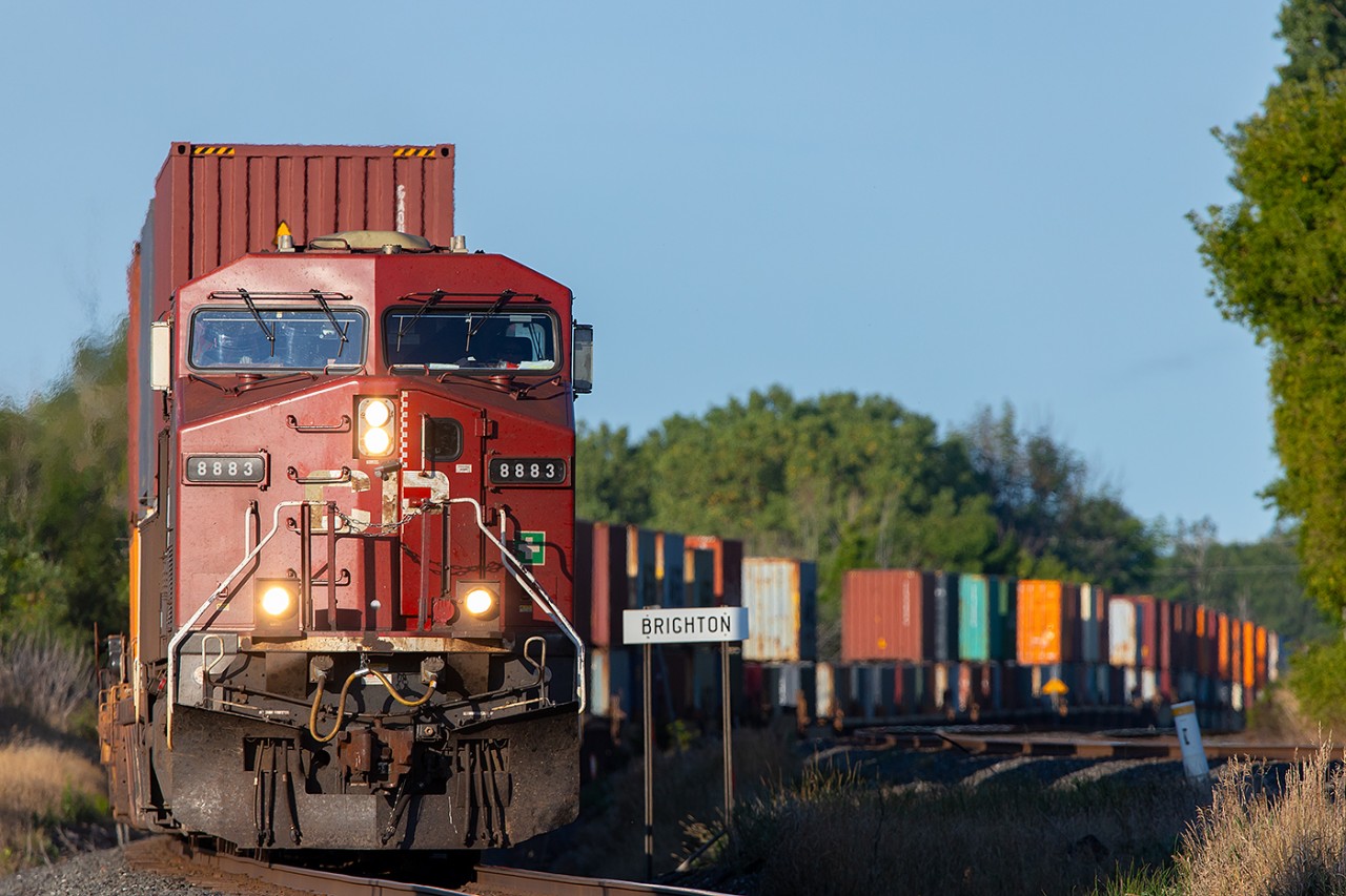 CP 8883 leads a morning eastbound through Brighton.