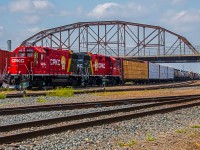 Freshly painted units CPKC 4418 & CPKC 3092 doing their daily yard work under the Arlington Bridge in the CPKC Higgins yard.