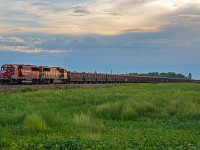 A fully loaded ballast train heading across the Manitoba prairies on their way into Winnipeg.