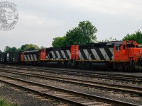 Tied down on track XV4, a set of CN power, consisting of GP40 9317, GP40-2LW 9530, and F7Au 9165, await their next assignment.