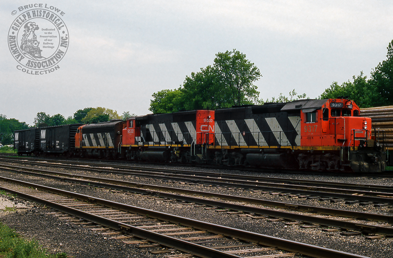 Tied down on track XV4, a set of CN power, consisting of GP40 9317, GP40-2LW 9530, and F7Au 9165, await their next assignment.