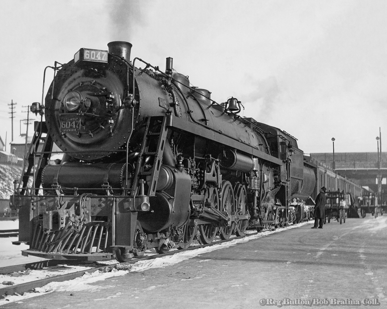 Waiting to depart on an eastbound passenger train for Toronto, CNR U-1-e Mountain 6047 stands at Hamilton;s James Street station.

Reg Button/Bob Bratina Collection.