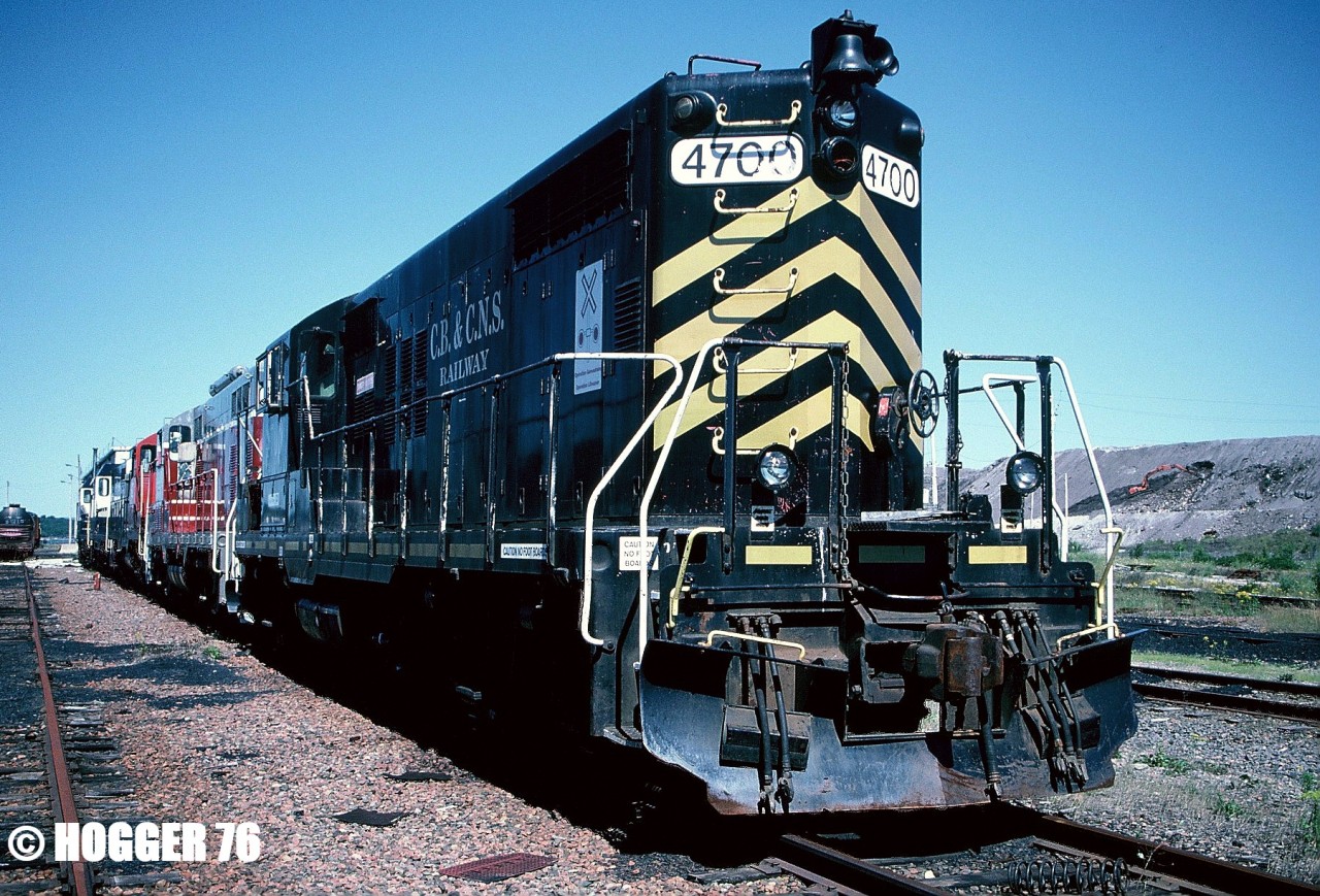 Cape Breton and Central Nova Scotia Railway (CBNS) GP18 4700, which is former Grand Trunk Western 4700, sits stored in the deadline with several other units in Sydney, Nova Scotia. The GP18 was named “Gerard MacNeil” and was scrapped by CBNS in 2007. The other units in the deadline were GEXR GP7u 700, IORY GP9 62 as well as GSWR GP7u 2160 and GSWR GP7u 2176.
