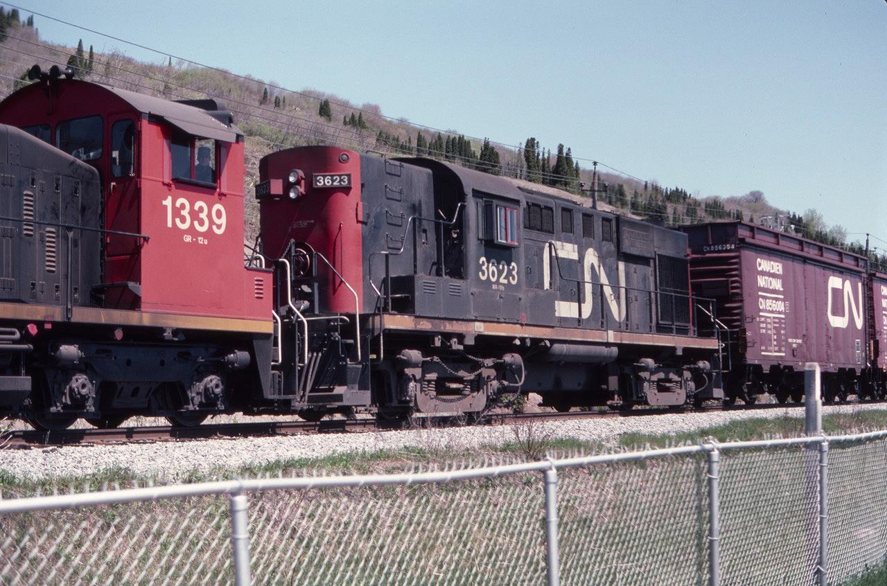 I found this slide from May of 1982 and had to laugh. We had just arrived at Montmorency Falls, Quebec, on the tour bus during a high school French class trip from Lyons, NY, (south of the border) when here came a westbound CN freight train, right on top of us. The lead switcher was not of much interest to me, but the MLW RS-18 CN 3623 certainly was. Note that the lead freight car, CN 856004, is interesting, perhaps a wood chip car?? I can't tell you anything about Montmorency Falls because I stayed outside the park (much to the chagrin of our chaperones) waiting for another train that sadly never came. Little did I know at the time that the Murray Bay Subdivision was not a CN mainline. There is a tourist train there now - I should go back and look at the falls.