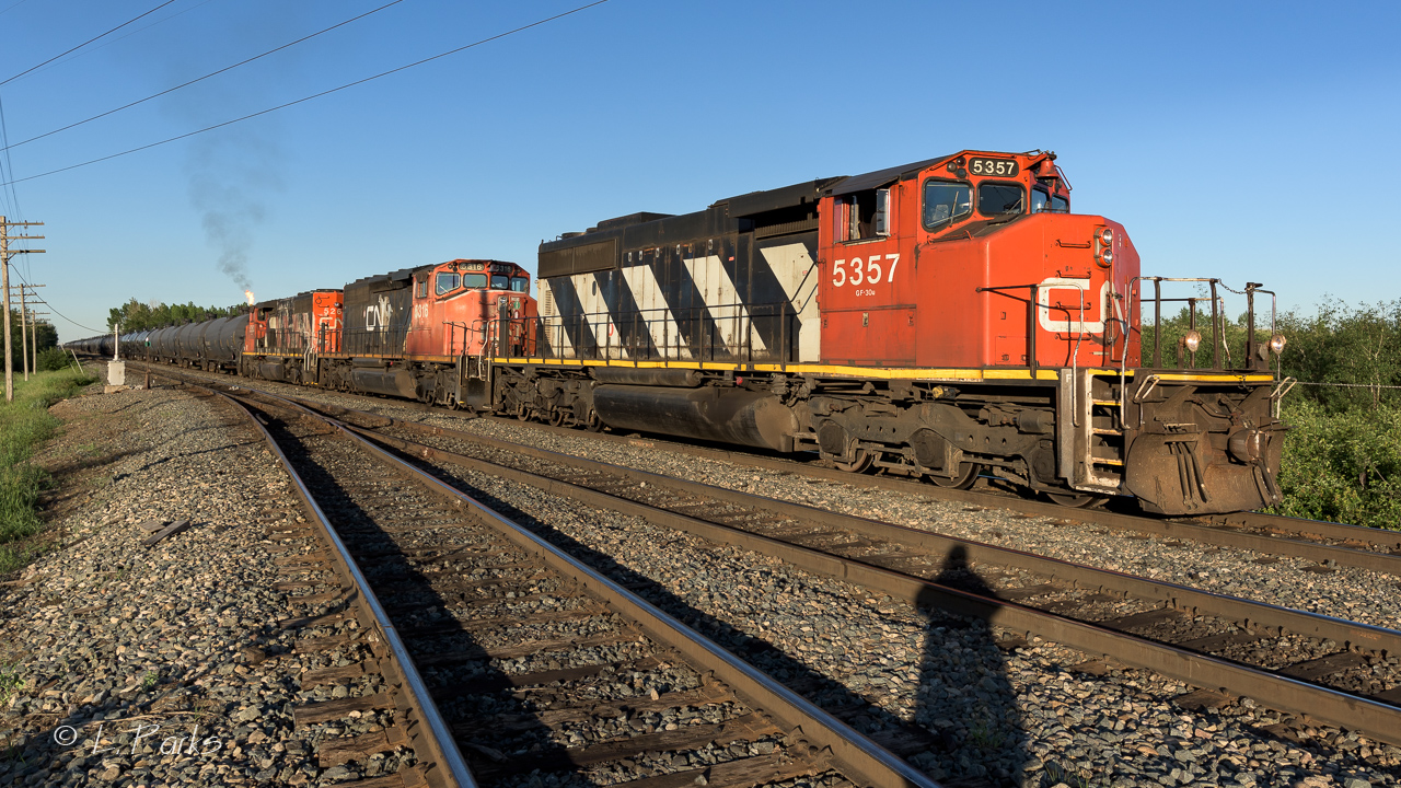 A seemingly endless train of tanks waiting at Bretville Jct. for traffic to clear on the Wainwright Sub. Approx. an hour and a half later they were given the okay and a light to proceed to Walker yard.