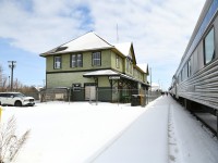 <b> Watch Your Step </b> <br>
VIA 002 is making its station stop in Melville, SK shortly after a surprise late spring snowfall. The platform has yet to be cleaned making for a sloppy and slippery walk for the few that chose to detrain. <br>
Restoration work continues on the classic CN station.