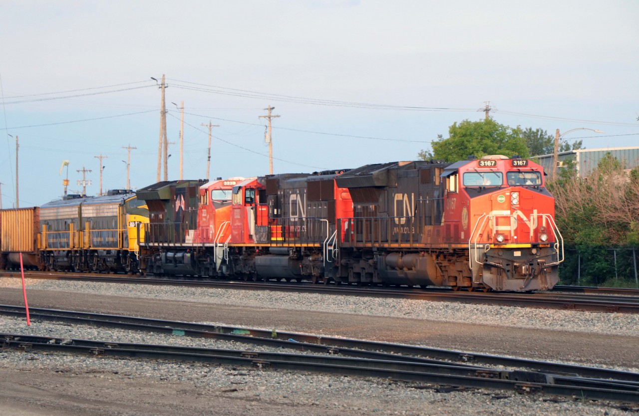 Tonight's 417 is an interesting one--trailing the normal power we have a CN "military" unit and the FP9A/F9B units from the Alberta Railway Museum headed for public display in Jasper on the upcoming long weekend. Unfortunately, the train would depart after dark because the F9B had to be set off. (It made tomorrow's train.)
Complete consist ET44AC 3167, SD75IACC 8332, ET44AC 3233, FP9A 6514, and F9B 6614.