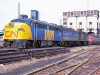 It's the spring of 1978 and change is in the air--not just the weather, but for rail passenger service in Canada. VIA Rail Canada is no longer a subsidiary of CN (1 April 1978) and has acquired CN's passenger equipment. CP's passenger equipment and operations will be acquired by fall (28 October 1978). For now, much of the equipment operating is still in CN or VIA CN colours. And, as hard as it is to think this, by 1986 the Spadina roundhouse and coach yard will have closed. Savour this moment--it won't last for long. Power in the photo: FPA4 6778, F9B 6622, RS18 3109 with FPA4 6777, another F9B and RS18 in the distance.
