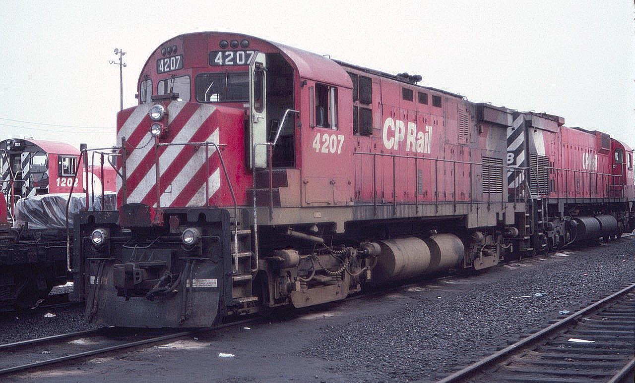 Ah the good old days when CP MLW C424's roamed the earth. Here is the 4207 at Agincourt Diesel Terminal in August of 1983. Dad drove in like he owned the place and read the Globe and Mail while I took photos. Note the black diesel-soaked ground between the rails - that would be frowned upon today.