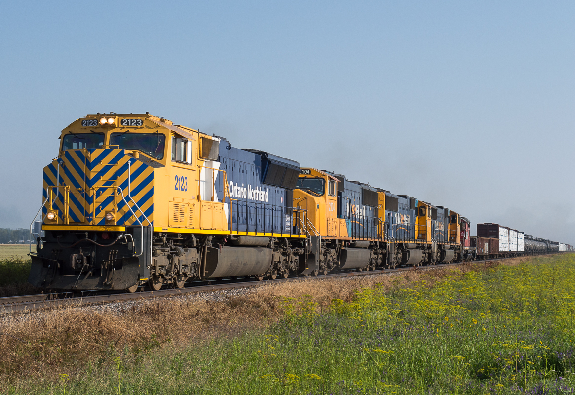 ONR 214 heads South through Earlton behind ONT 2123, ONT 2104, ONT 2102, ONT 2103 and JLCX 2002. The 2002 is headed for North Bay after coming out of Rouyn Noranda.