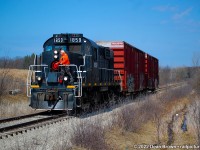 TRRY RS18u 1859 heads northbound approaching Port Robinson Rd. on the Canal Sub heading back from St. Catharines and are on their way back home to Welland.

The conductor has to flag the crossing at Port Robinson because the crossing Protections are out of service.