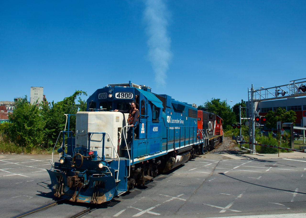 CN 4900 lets out some smoke as CN 500 returns from the Port of Montreal.