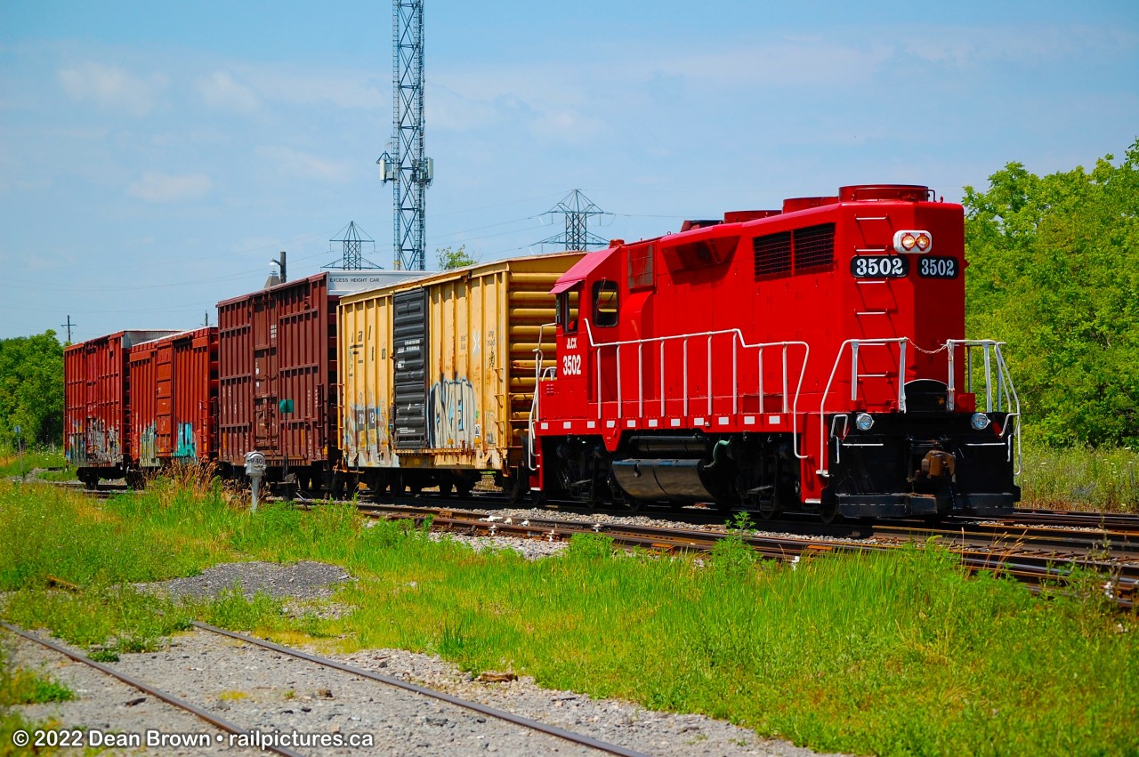 JLCX GP35 3502 is heading southbound from St. Catharines and is now on the CN Grimsby Sub heading westward towards Glenridge to do the crossover and then head east on the south track for the Thorold Spur for Welland.
