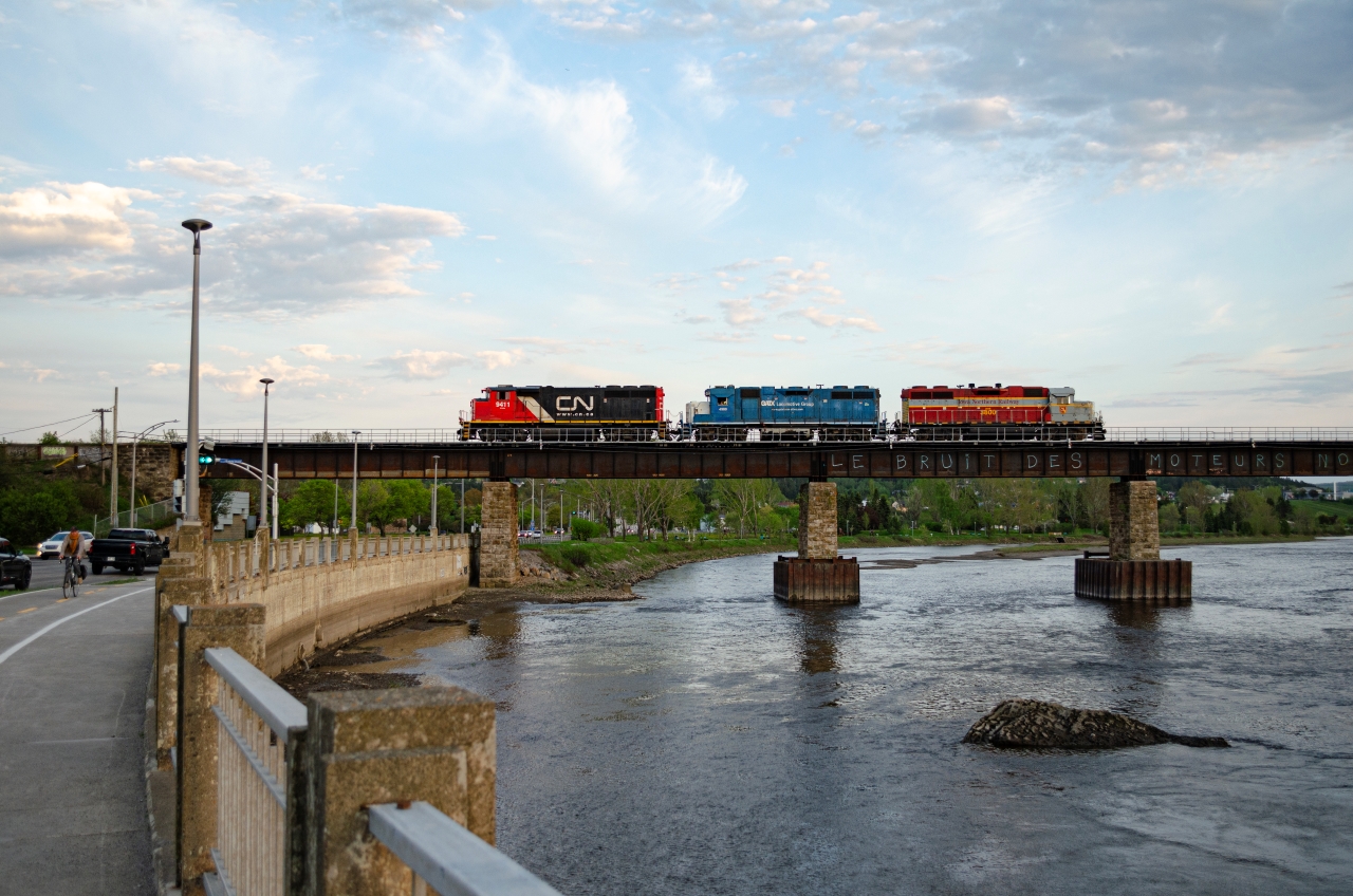 A very early 559 returns to Mont-Joli with an IANR GP38-2 they picked up in Rivière-du-Loup, destinated to Mont-Joli, where they will wait their turn for the COGEMA ferry. As it turned out, these IANR engines weren't actually meant to be sent to the north shore, and were brought back to Montreal a few days later.

 This shot was a very lucky one, as 559 usually returns home in the middle of the night. In fact, at this time of the evening, at around 8 PM, it usually is the westbound trip that can be seen.