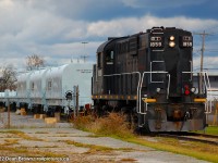 TRRY RS18u 1859 is lifting the coil cars at Stelcon, the ones with the covers on them.