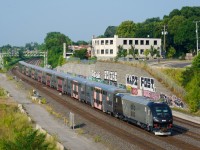 Running as EXO E-211, EC42 SIIX 1400 pushes ten CRRC cars westbound on CN's Montreal Sub, on their way to various clearance tests on three CPKC lines.