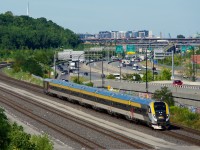 With CN imposing crossing-related speed restrictions on the standard 24-axle VIA Rail Siemens consists on any lines that it owns, VIA Rail has started adding two more cars to two consists so far (CN has no restrictions on Siemens consists of 32 axles or greater). Here VIA 37 with 32 axles is approaching Turcot Ouest.