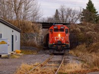 Their work complete at Agromart, CN L518 shoves south along the Marmora Spur, ducking beneath the Kingston Sub.  After VIA 65 clears Trenton Jct, the short train will climb the connecting track to the Kingston Sub and head for Belleville.