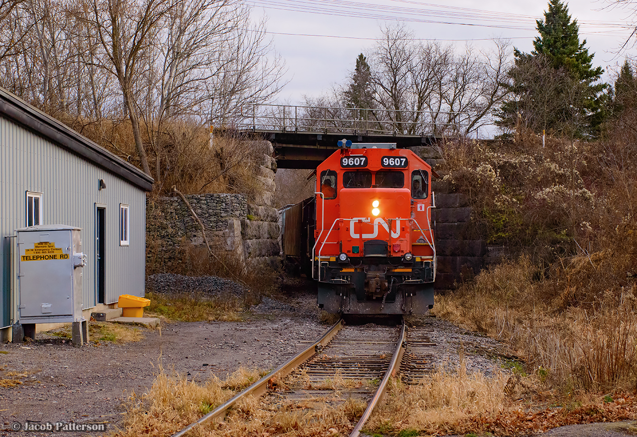Their work complete at Agromart, CN L518 shoves south along the Marmora Spur, ducking beneath the Kingston Sub.  After VIA 65 clears Trenton Jct, the short train will climb the connecting track to the Kingston Sub and head for Belleville.