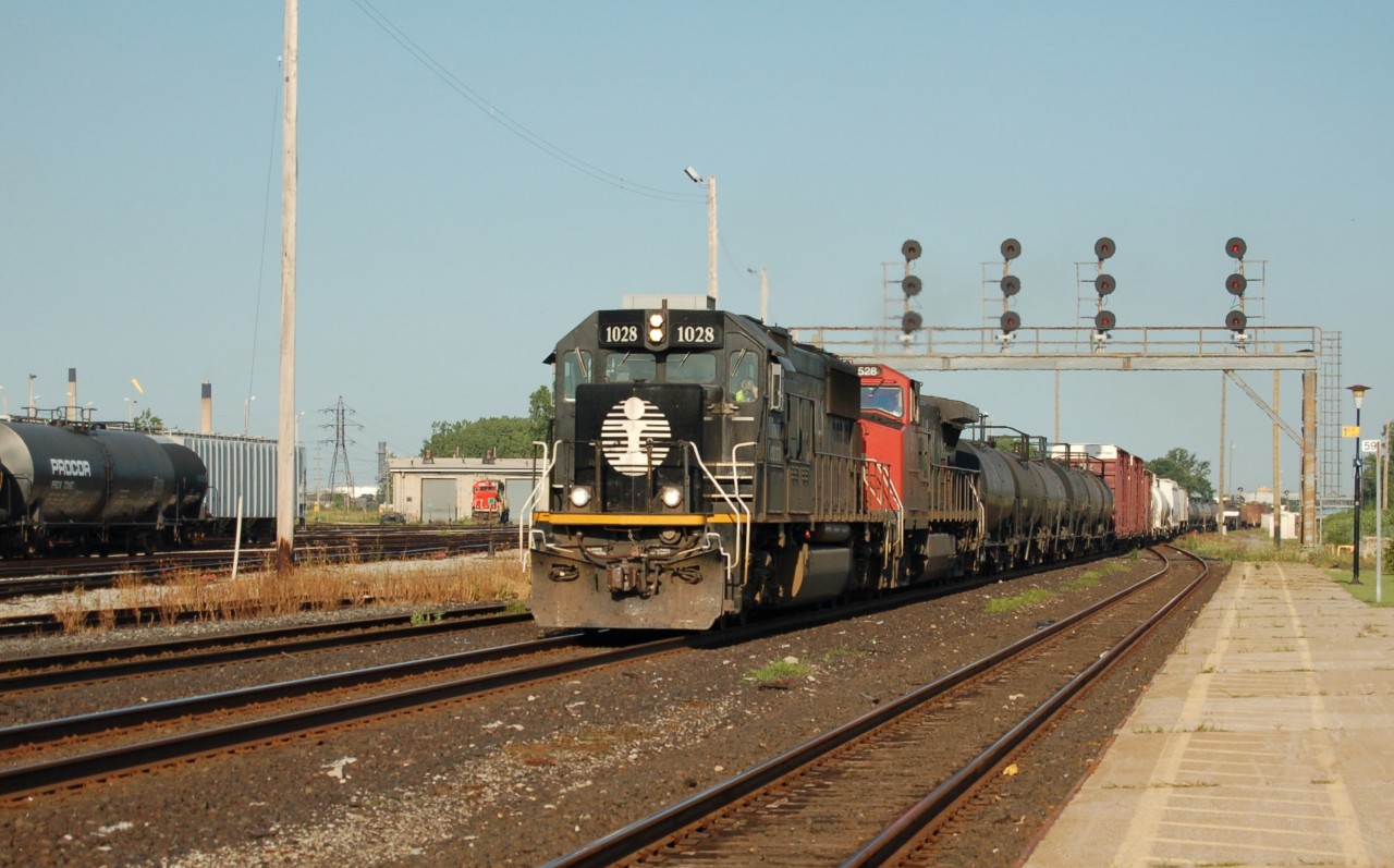 IC 1028 and CN 2528 with a eastbound freight at Sarnia.