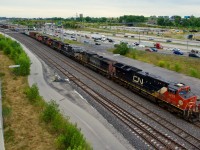 CN 401 is passing Turcot Ouest with a varied six-unit lashup (CN 3213, UP 6318, NS 4712, CN 5622, CN 8855 & CN 4722). The SP-painted unit had gone east on ethanol train CN 714.
