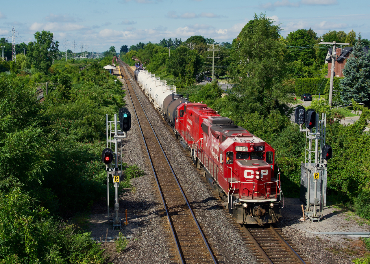 CPKC G95 splits the signals at MP 8.7 of the Vaudreuil Sub with CP 3051, CP 4515 and some tank cars as it heads east towards Lachine IMS Yard.