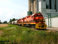 Goderich-Exeter Railway 581 is approaching the Road 168 crossing, passing the Sylvite Agri-Services facility, situated just outside the town of Mitchell, Ontario along the Goderich Subdivision. RLHH GP38-2 2111 and HESR GP38-2 3510 have a good size train returning from Goderich as they head back to Stratford. 